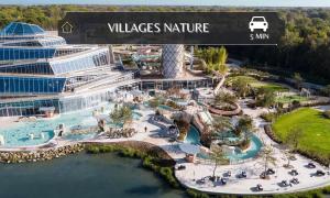 an aerial view of a pool at a resort at The Comte House - 16 Guests Near Disney in Villeneuve-le-Comte