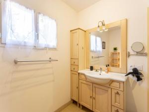 a bathroom with a sink and a mirror and a shower at Casa-des Oliviers maison vacances avec piscine in Montmeyan +37 photos