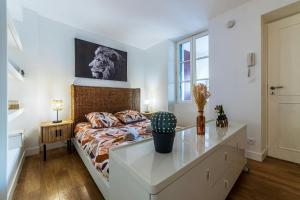 Ένα ή περισσότερα κρεβάτια σε δωμάτιο στο Charmant appartement COSY au cœur de Fontainebleau