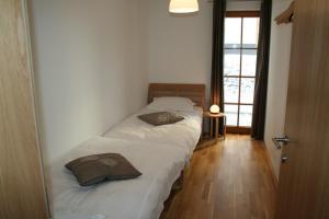 Ένα ή περισσότερα κρεβάτια σε δωμάτιο στο Eva Maria 1 by SMR Rauris Apartments - inc Spa and near Gondola +27 φωτογραφίες