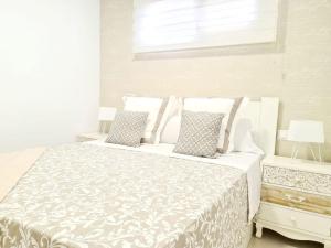 A bed or beds in a room at Apartamento Moderno y con Estilo en La Carihuela