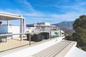 a balcony of a house with a view of the mountains at Exclusivo Atico en La Cala Golf in La Cala de Mijas