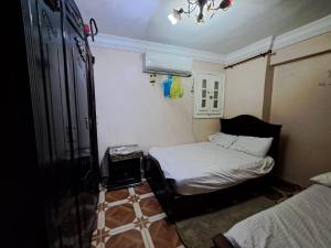 Postel nebo postele na pokoji v ubytování KENZY Apartment + 40 fotografií