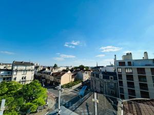 an aerial view of a city with buildings at We Live In R - Suite 401 in Reims