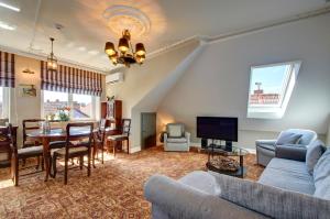 a living room with a couch and a table at German18-3B Luxury Vilnius apartment in Vilnius