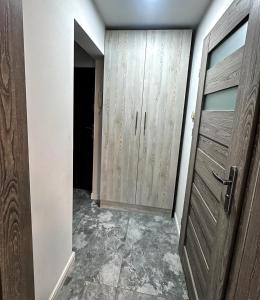 an empty room with a closet and a door at Sixth Corner in Świnoujście
