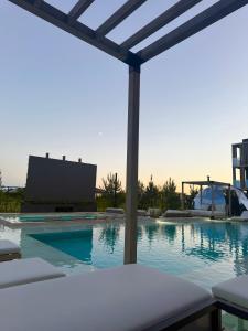 a swimming pool with a view of a building at Apartamentai INFINITUM SEA in Palanga
