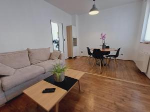 a living room with a couch and a table at Cap au Nord in Dunkerque