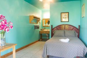 Ein Bett oder Betten in einem Zimmer der Unterkunft Sea Eye Hotel - Laguna Building