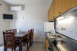 Kuchyň nebo kuchyňský kout v ubytování Mythos Suites-Poseidon apartment