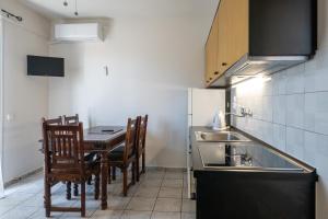 Kuchyň nebo kuchyňský kout v ubytování Mythos Suites-Poseidon apartment
