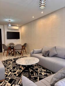 a living room with a couch and a table at Nice apartment in Marrakesh in Marrakesh