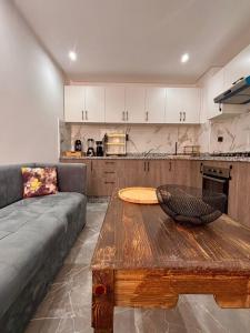 a living room with a couch and a wooden table at Nice apartment in Marrakesh in Marrakesh