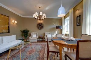 a living room with a white couch and a table at German18-3A Luxury Vilnius apartment in Vilnius