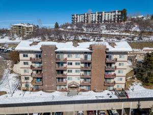 an apartment building with snow on top of it at Ski In, Ski Out, Ski Slope Views, California King, Recently Renovated in Steamboat Springs