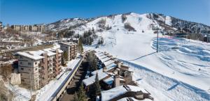 a resort in the snow with a ski slope at Ski In, Ski Out, Ski Slope Views, California King, Recently Renovated in Steamboat Springs