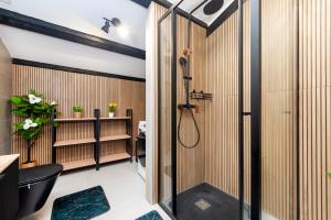 a bathroom with a shower and a toilet at Apartman Rio in Rovinj +2 photos