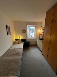 Postel nebo postele na pokoji v ubytování Aparthotel Zur Linde - by Willms & Schömer eG