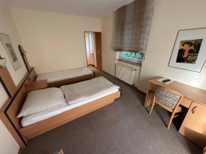 Postel nebo postele na pokoji v ubytování Aparthotel Zur Linde - by Willms & Schömer eG