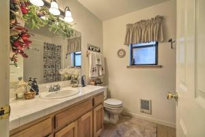 a bathroom with a sink and a toilet at Game Room and Deck Pet-Friendly Camp Connell Cabin in Camp Connell +21 photos