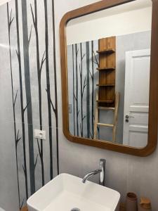 a bathroom with a sink and a mirror at Casale Guaceto in Carovigno
