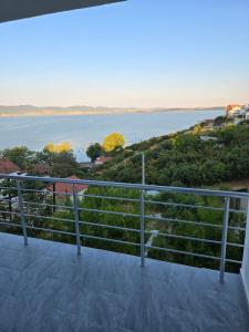 a view of the water from the balcony of a house at Apartment Mila in Nov Dojran +7 photos