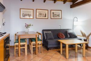 a living room with a couch and a table at Villa Sanziana in Menaggio
