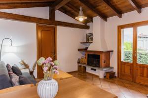 a living room with a couch and a table at Villa Sanziana in Menaggio