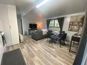 a living room with a couch and a table at Mountain Escape in Wentworth Falls