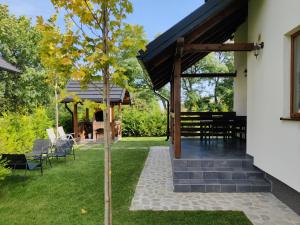 a tree in the yard of a house at Ara Chalet in Bran