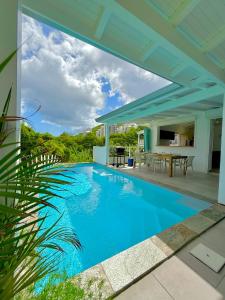 a swimming pool in the backyard of a house at Villa Tulia in Chambort