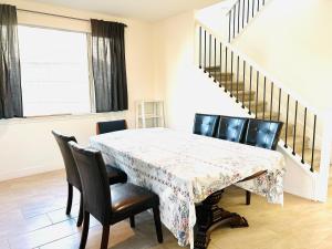 a dining room with a table and chairs at Cozy Private master bedroom in a single family house in Elk Grove +1 photo