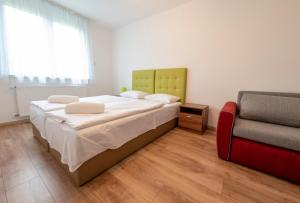 Postel nebo postele na pokoji v ubytování Veritas Apartment Zamárdi