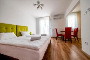 Postel nebo postele na pokoji v ubytování Veritas Apartment Zamárdi