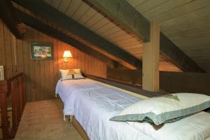 a bedroom with two beds in a attic at Discovery 4 142 Loft in Mammoth Lakes +11 photos