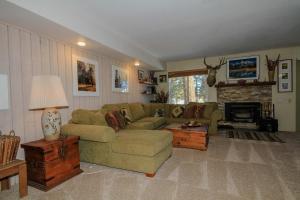 a living room with a couch and a fireplace at Discovery 4 137 in Mammoth Lakes