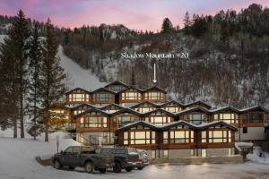 a large lodge with a car parked in front of it at Shadow Mountain 20 in Aspen