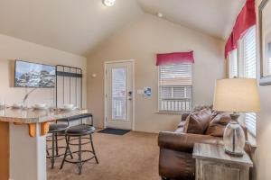 a living room with a couch and a table at Baby Bear Cabin in West Yellowstone