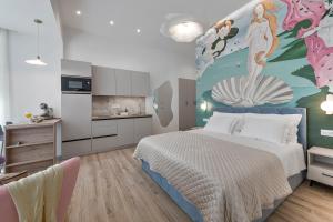 a bedroom with a large bed with a painting on the wall at Rebirth apartments in Dubrovnik