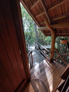 an open door to a porch of a cabin at Refúgio Morada do Rei in Rio dos Bugres