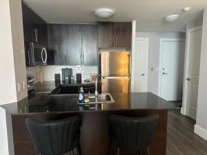 A kitchen or kitchenette at Stylish 2BR Suite by Square One