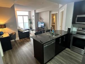 A kitchen or kitchenette at Stylish 2BR Suite by Square One