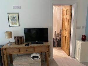 TV a/nebo společenská místnost v ubytování Gooig Getaway