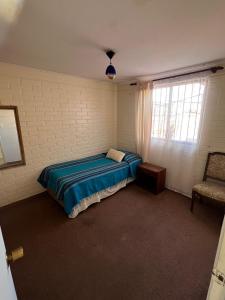 Postel nebo postele na pokoji v ubytování Casa Coquimbo Verano