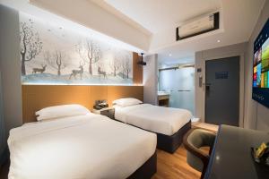 Postel nebo postele na pokoji v ubytování Urba International Apartment in Chaozhou Ancient City People's Square Branch + 39 fotografií