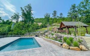 a swimming pool in a yard with a gazebo at Pop A Bear in Pittman Center