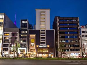 a group of buildings in a city at night at APA Hotel Nagoya Sakae Ekimae EXCELLENT in Nagoya