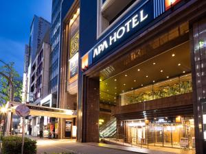 a store front of a building on a city street at APA Hotel Nagoya Sakae Ekimae EXCELLENT in Nagoya
