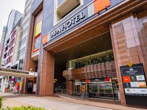 a store front of a building on a city street at APA Hotel Nagoya Sakae Ekimae EXCELLENT in Nagoya
