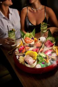 a table with a plate of food on a table at ette luxury hotel & spa - Near Disney Theme Parks in Orlando